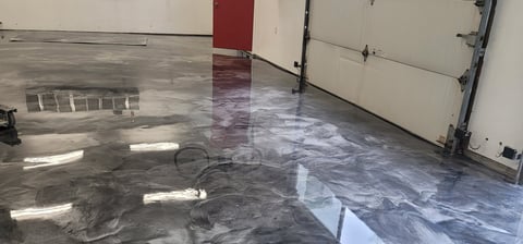 Beautiful metallic epoxy floor finish in garage